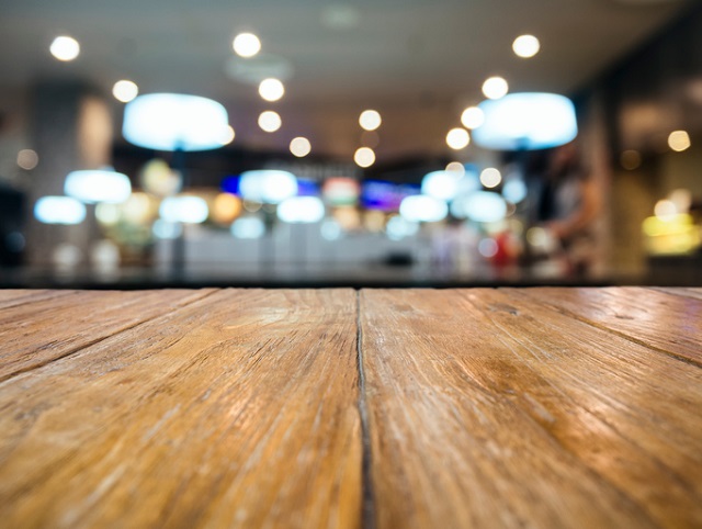Table top Counter with Blurred Restaurant Shop interior